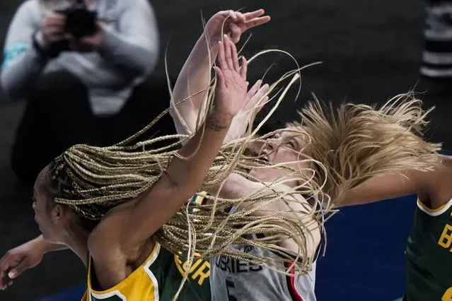 Baylor's DiJonai Carrington shoots past UConn's Paige Bueckers during the second half of an NCAA college basketball game in the Elite Eight round of the Women's NCAA tournament Monday, March 29, 2021, at the Alamodome in San Antonio. (Photo by Morry Gash/AP Photo)