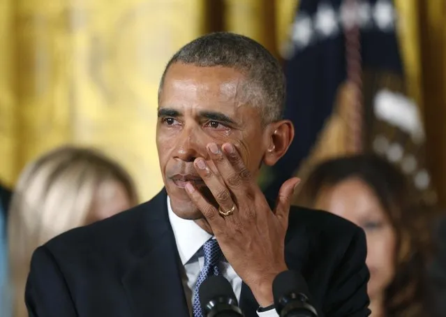 U.S. President Barack Obama wipes away tears while talking about Newtown and other mass shooting during an event held to announce new gun control measures, at the White House in Washington January 5, 2016.  The White House unveiled gun control measures on Monday that require more gun sellers to get licenses and more gun buyers to undergo background checks, moves President Obama said were well within his authority to implement without congressional approval. (Photo by Kevin Lamarque/Reuters)
