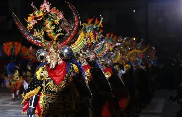 Dancers perform the traditional “Diablada” or Dance of the Devils during carnival celebrations in Oruro, Bolivia, Saturday February 14, 2015. (Photo by Juan Karita/AP Photo)