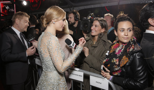 Lily James being interviews by AP's Marcela Isaza at the World Premiere Of "Cinderella" on Sunday, March 1, 2015, in Los Angeles. (Photo by Todd Williamson/Invision/AP)