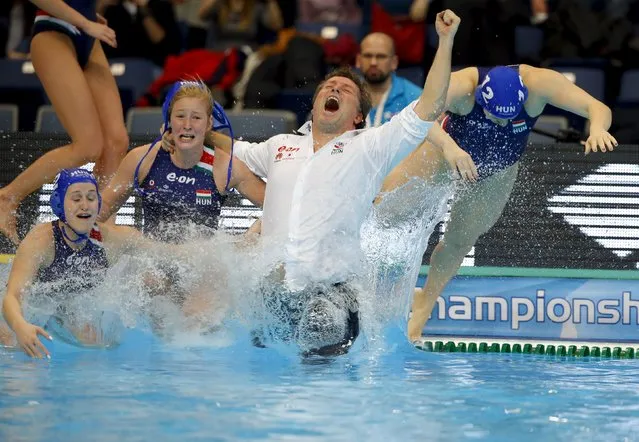 Hungary's coach Attila Biro jumps in the pool as he celebrates his team's victory over Netherlands during the women's European Water Polo Championship gold medallion match in Belgrade, Serbia January 22, 2016. (Photo by Laszlo Balogh/Reuters)