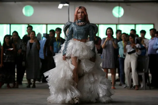 A model wears a dress made out of recycled material during a show organised by LGBT fashion designers to battles discrimination in Phnom Penh, Cambodia, October 24, 2018. (Photo by Samrang Pring/Reuters)