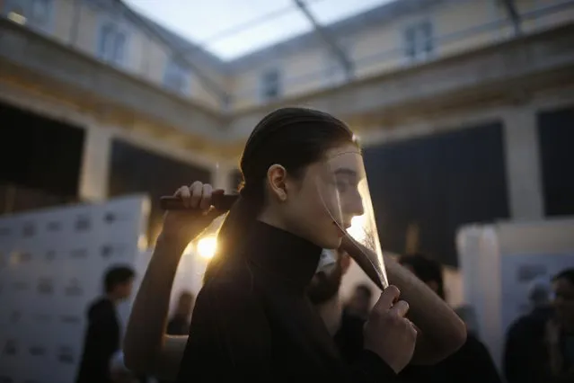 A model is prepared backstage before Sangue Novo show during Lisbon Fashion Week March 13, 2015. (Photo by Rafael Marchante/Reuters)