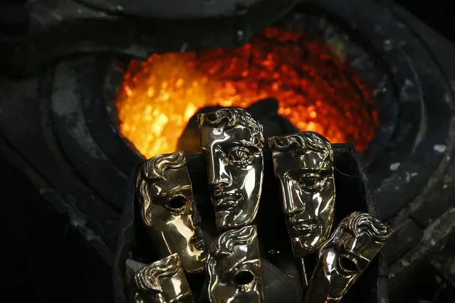 Damaged British Academy of Film and Television Arts awards are seen before being recycled in a furnace to make new ones during the casting process of a British Academy of Film and Television Awards (BAFTA) masks at a foundry in west London, Britain February 4, 2016. The masks are being cast and finished at the foundry ahead of the 2016 BAFTA Awards Ceremony which takes place in London on February 14. (Photo by Stefan Wermuth/Reuters)