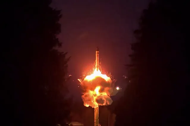 This video grab from a handout footage released by the Russian Defence Ministry press service on October 25, 2023 shows the firing of a Yars intercontinental ballistic missile from the Plesetsk cosmodrome in the Russian north during a training exercise of the forces and equipment of ground, sea and air components of nuclear deterrent forces. (Photo by Russian Defence Ministry/Handout via AFP Photo)