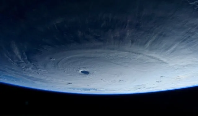 This image taken Tuesday March 31, 2015 shows Typhoon Maysak taken by astronaut Samantha Cristoforetti from the International Space Station. The Pacific Daily News newspaper in Guam reports the storm was upgraded Tuesday to a super typhoon with winds of 150 mph and was moving west-northwest at 15 mph. Officials say super Typhoon Maysak is expected to significantly weaken before reaching the Philippines around Sunday. (Photo by Samantha Cristoforetti/AP Photo/NASA)