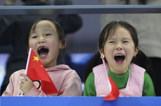 Chinese girls cheer as they watch the 14th FINA World Swimming Championships in Hangzhou, China Friday, December 14, 2018. (Photo by Ng Han Guan/AP Photo)