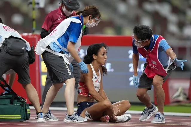 Katarina Johnson-Thompson, of Britain, reacts after falling during a heat in the heptathlon women's 200-meter at the 2020 Summer Olympics, Wednesday, August 4, 2021, in Tokyo. (Photo by Martin Meissner/AP Photo)