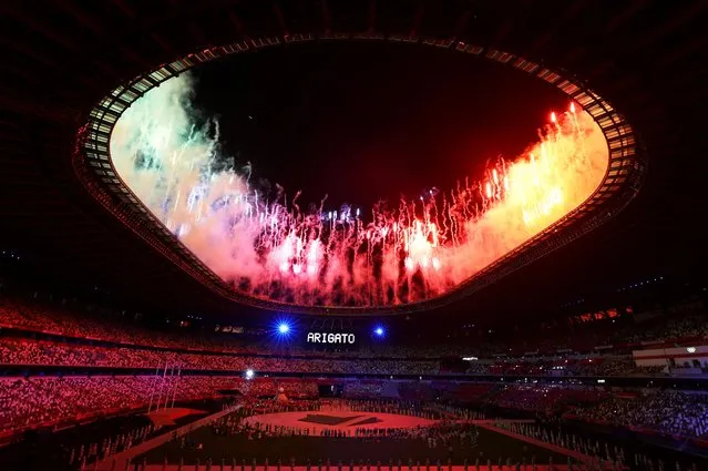Fireworks go off around the Olympic Stadium during the closing ceremony of the Tokyo 2020 Olympic Games, as seen from outside the venue in Tokyo on August 8, 2021. (Photo by Amr Abdallah Dalsh/Reuters)