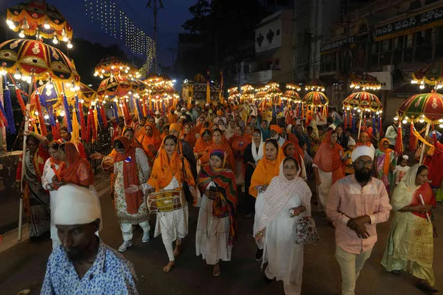 Sikh devotees participate in a religious procession ahead of the birth anniversary of the first Sikh guru, Guru Nanak, in Hyderabad, India, Saturday, November 25, 2023. The birth anniversary of Guru Nanak will be marked on Nov. 27. (Photo by Mahesh Kumar A./AP Photo)