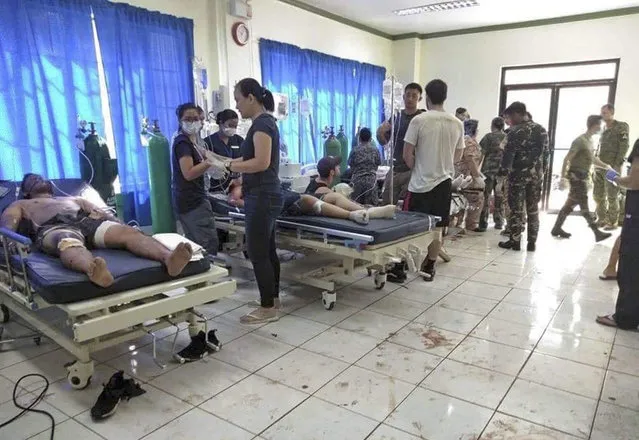 In this photo provided by WESMINCOM Armed Forces of the Philippines, bomb victims receive treatment in a hospital after two bombs exploded outside a Roman Catholic cathedral in Jolo, the capital of Sulu province in southern Philippines where militants are active Sunday, January 27, 2019. The Philippine government says it will "pursue to the ends of the earth the ruthless perpetrators" behind bomb attacks that killed over a dozen people and wounded many more during a Sunday Mass at a cathedral on the restive southern island. (Photo by WESMINCOM Armed Forces of the Philippines via AP Photo)