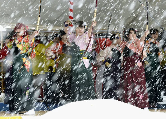 Women in traditional dresses attend in a traditional archery event for celebrating the coming of age in the heavy snow at Sanjusangendo temple in Kyoto, western Japan, in this photo taken by Kyodo January 15, 2017. (Photo by Reuters/Kyodo News)