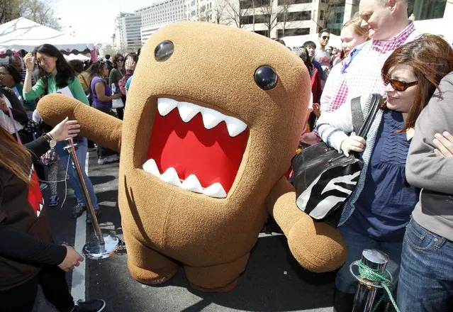 NHK World mascot Domo poses with the crowd at the 55th annual Sakura Matsuri during the Cherry Blossom Festival on Saturday, April 11, 2015 in Washington, D.C. Sakura Matsuri celebrates the blooming of the cherry blossom trees, a gift to the U.S. from Japan. (Photo by Paul Morigi/AP Images for NHK WORLD TV)