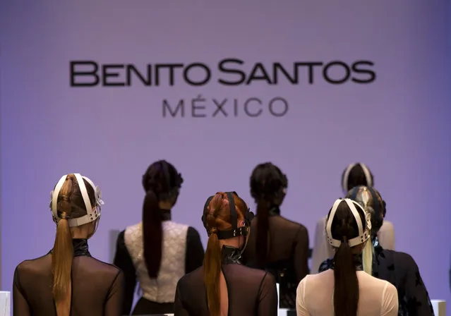 Models leave the runway following a show by Mexican designer Benito Santos, at Mercedes-Benz Fashion Week in Mexico City, Tuesday, April 14, 2015. (Photo by Rebecca Blackwell/AP Photo)