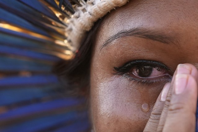 An Indigenous woman cries after the Supreme Court judges' decision to suspend the vote that defines the demarcation of Indigenous lands, during a protest in front of the Supreme Court building, in Brasilia, Brazil, Wednesday, September 15, 2021. (Photo by Eraldo Peres/AP Photo)