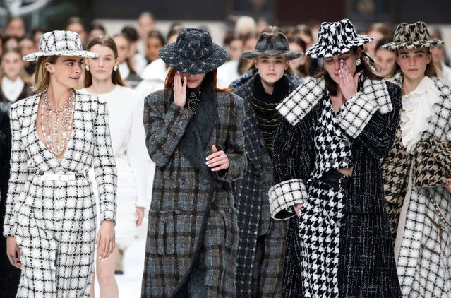 Cara Delevingne and other models react while presenting creations by late designer Karl Lagerfeld as part of his Fall/Winter 2019-2020 women's ready-to-wear collection show for fashion house Chanel at the Grand Palais during Paris Fashion Week in Paris, France March 5, 2019. (Photo by Regis Duvignau/Reuters)