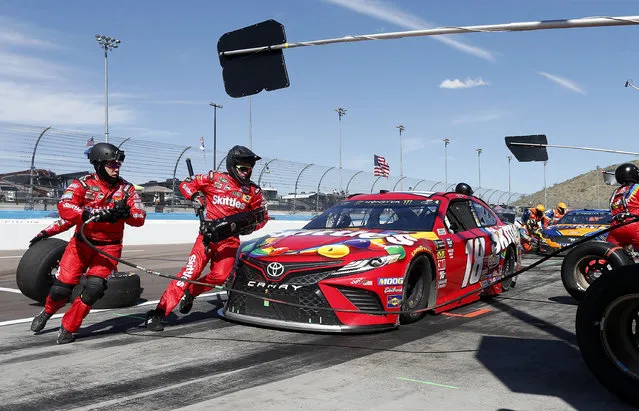 Driver Kyle Busch makes a pit stop on lap 153 during the NASCAR Cup Series auto race at ISM Raceway, Sunday, March 10, 2019, in Avondale, Ariz. (Photo by Ralph Freso/AP Photo)