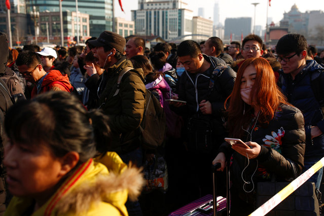 People line up at the subway station outside Beijing Railway Station on the last day of Chinese Lunar New Year holidays in Beijing, China, February 2, 2017. (Photo by Thomas Peter/Reuters)
