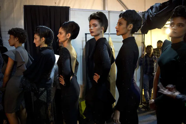 In this Saturday, March 16, 2019, photo, models line up backstage before the start of a catwalk during Lotus Makeup India Fashion Week, in New Delhi, India. (Photo by Manish Swarup/AP Photo)