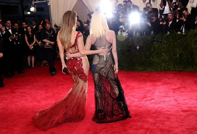 Jennifer Lopez, left, and Donatella Versace  arrive at The Metropolitan Museum of Art's Costume Institute benefit gala celebrating “China: Through the Looking Glass” on Monday, May 4, 2015, in New York. (Photo by Charles Sykes/Invision/AP Photo)
