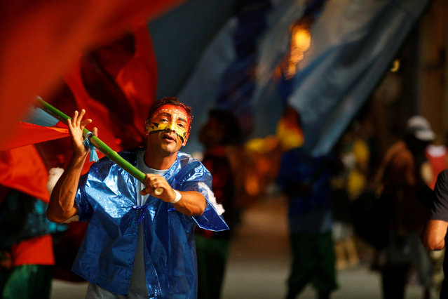 A member of a comparsa, a Uruguayan carnival group, participates during the Llamadas parade, a street fiesta with traditional Afro-Uruguayan roots in Montevideo February 9, 2017. (Photo by Andres Stapff/Reuters)