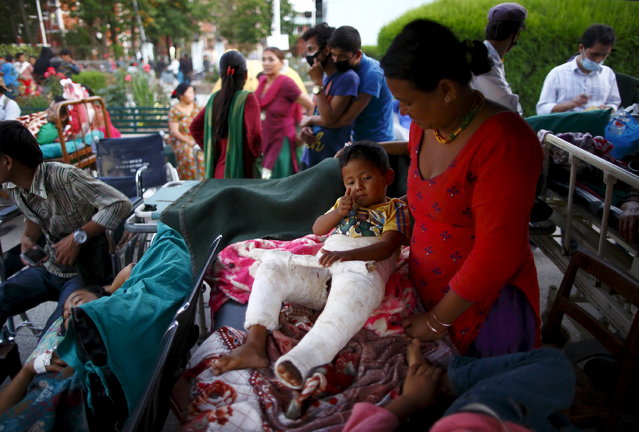 Earthquake victims are kept on the open ground for treatment after the earthquake, in Kathmandu, May 12, 2015. (Photo by Navesh Chitrakar/Reuters)
