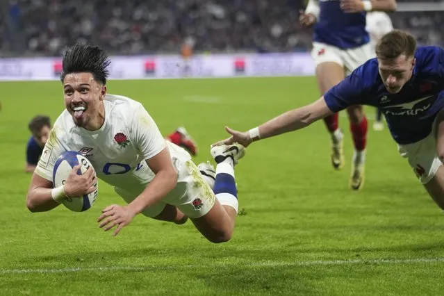 England's Marcus Smith reacts as he scores a try during the Six Nations rugby union international match between France and England at Groupama Stadium, Lyon, France, Saturday, March 16, 2024. (Photo by Laurent Cipriani/AP Photo)
