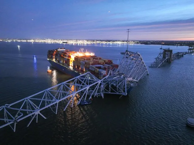 In this aerial view, the collapsed Francis Scott Key Bridge after a collision with cargo ship Dali, in Baltimore, Maryland, United States on March 26, 2024. According to the Maryland Transportation Authority (MTA), all lanes are closed in both directions, and traffic is being diverted. (Photo by Lokman Vural Elibol/Anadolu via Getty Images)