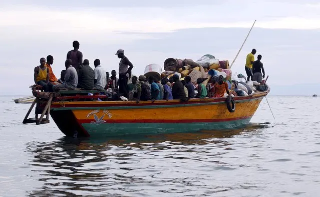 Burundian refugees sail on boat near the shores of Lake Tanganyika in Kagunga village in Kigoma region in western Tanzania to Kigoma township, May 17, 2015. (Photo by Thomas Mukoya/Reuters)