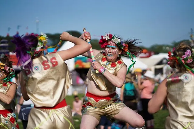 Dancers perform for festival goers during Glastonbury Festival at Worthy farm in Somerset, Britain on June 26, 2019. (Photo by Henry Nicholls/Reuters)