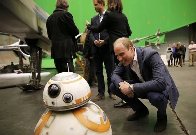 Britain's Prince William, smiles at BB-8 droid during a tour of the Star Wars sets at Pinewood studios in Iver Heath, west of London, Britain on April 19, 2016. (Photo by Adrian Dennis/Reuters)