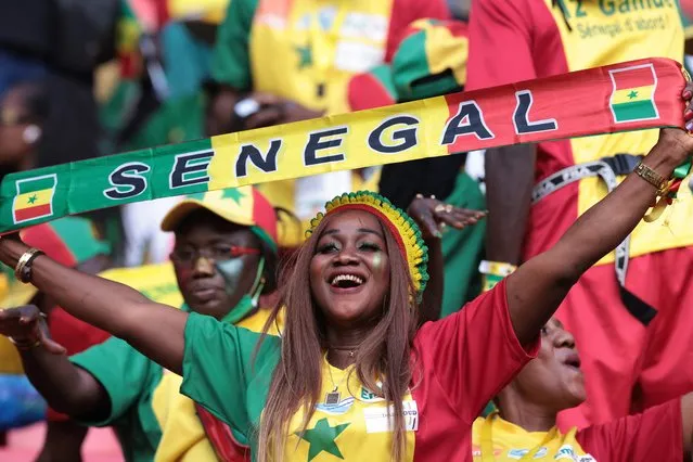 A Senegal's supporter cheers ahead of the Africa Cup of Nations (CAN) 2021 final football match between Senegal and Egypt at Stade d'Olembe in Yaounde on February 6, 2022. (Photo by Kenzo Tribouillard/AFP Photo)