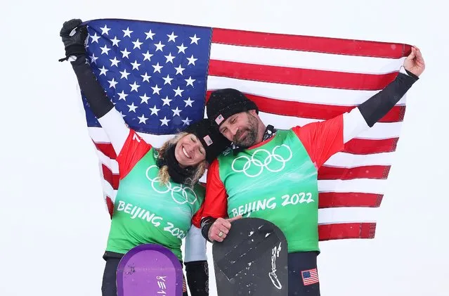 Gold medallists Lindsey Jacobellis (L) and Nick Baumgartner of Team United States celebrate during the Mixed Team Snowboard Cross Finals flower ceremony on Day 8 of the Beijing 2022 Winter Olympics at Genting Snow Park on February 12, 2022 in Zhangjiakou, China. (Photo by Cameron Spencer/Getty Images)