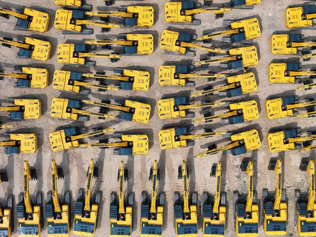 A batch of excavators is being prepared for export at a port in Yantai, China, on June 2, 2024. Data released on May 31, 2024, by the Service Industry Survey Center of the National Bureau of Statistics and the China Federation of Logistics and Purchasing shows that in May 2024, the equipment manufacturing PMI (purchasing managers' index) is 50.7%, down 0.6 percentage points from the previous month. (Photo by Costfoto/NurPhoto/Rex Features/Shutterstock)