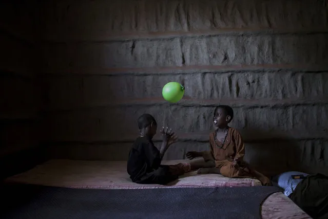 Maydiigo 6-year-old and Abaay 7-year-old play at the Owdiinl village in Somalia's Bay state on April 04, 2017. Maydiigo with her mother, brothers and sisters moved to live with her relatives after her husband died of cholera. Haway also stated that they had total of 16 farm animals however 15 of them have died due to drought. In the central and south parts of Somalia, extreme drought threatens to leave many people hungry and vulnerable to disease epidemics. Somalians forced to live in the camps in Somalia's Bay state due to clashes and terror in the country are fighting drought and disease from makeshift tents. (Photo by Arif Hudaverdi Yaman/Anadolu Agency/Getty Images)