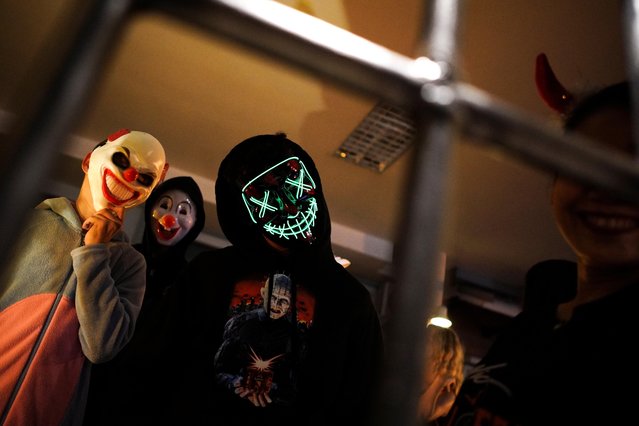 Participants wearing costumes attend a Halloween party at a village in Bangkok, Thailand, October 31, 2019. (Photo by Athit Perawongmetha/Reuters)