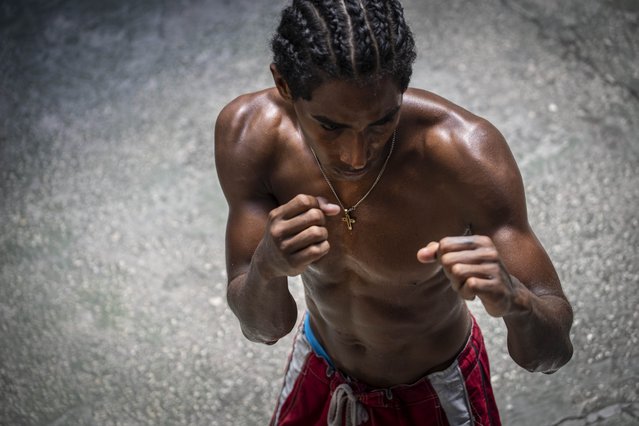 A boxer known as Jonathan trains at the Rafael Trejo boxing gym in Old Havana, Cuba, Wednesday, April 6, 2022. Cuba banned professional boxing shortly after the 1959 revolution, but boxers will be allowed to fight professionally in Cuba again for the first time under a deal with a Mexican promoter, officials announced March 4, 2022. (Photo by Ramon Espinosa/AP Photo)