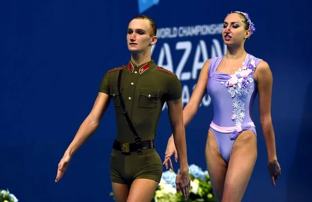 Russia's synchronised swimming duet Aleksandr Maltsev (L) and Darina Valitova compete in the Mixed Duet Technical preliminary during the synchronised swimming competition at the 2015 FINA World Championships in Kazan on July 25, 2015. (Photo by Christophe Simon/AFP Photo)