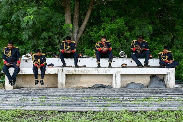 Railway Protection Force (RPF) band personnel rest before the start of a ceremony to mark India's Independence Day in Secunderabad on August 15, 2024. (Photo by Noah Seelam/AFP Photo)