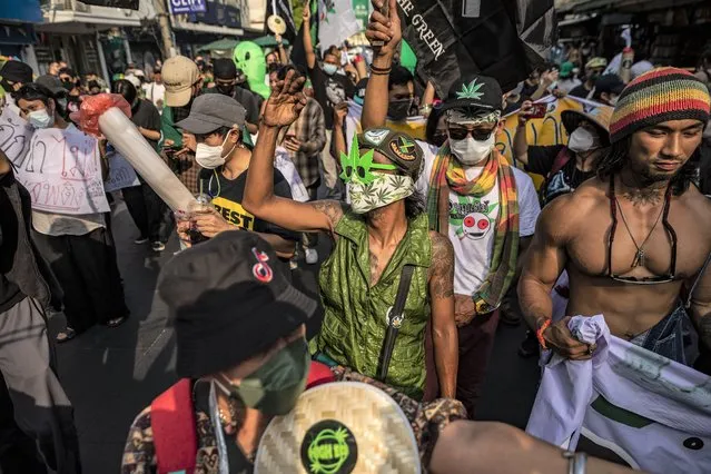 People participate in a 4/20 cannabis celebration march in the capital Bangkok, Thailand on April 20, 2022. (Photo by Andre Malerba/ZUMA Press Wire/Rex Features/Shutterstock)
