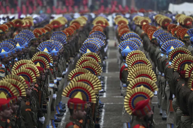 Indian paramilitary soldiers and policemen attend Indian Republic day parade in Srinagar, Indian controlled Kashmir, Sunday, January 26, 2020. The day marks the anniversary of India's democratic constitution taking force in 1950. (Photo by Mukhtar Khan/AP Photo)