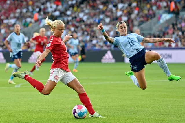 Denmark's striker Pernille Harder (L) is challenged by Spain's defender Maria Leon during the UEFA Women's Euro 2022 Group B football match between Denmark and Spain at Brentford Community Stadium in west London on July 16, 2022. (Photo by Justin Tallis/AFP Photo)