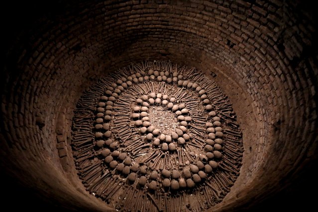 An interior view of the underground cemetery, located under the Church of San Francisco, which contains the remains of thousands of people who were buried between the 16th and 19th centuries as a requirement of religious beliefs, and attracts the attention of archaeologists and historians in Lima, Peru on September 18, 2023. The catacombs of the cemetery also feature a collection of skulls and bones, providing a different perspective on mortality and society's connection to death. Within the catacombs there are five pits, each about ten meters deep, containing skeletal remains. (Photo by Klebher Vasquez/Anadolu Agency via Getty Images)