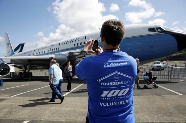 Jeff Foster, a business operations senior manager and 29-year Boeing employee, photographs a Boeing 707-120 Air Force One, at an event marking the centennial of The Boeing Company in Seattle, Washington July 15, 2016. (Photo by Jason Redmond/Reuters)