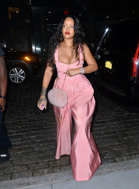 Rihanna looks striking in pink showing off her ample cleavage in NYC on September 17, 2017. (Photo by Splash News and Pictures)