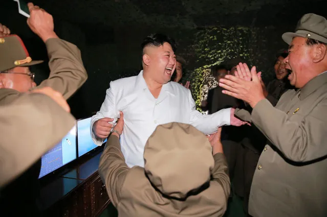In this undated photo distributed on Thursday, August 25, 2016, by the North Korean government, North Korean leader Kim Jong Un, center, visits the site of a submarine-launched missile test at an undisclosed location in North Korea. Independent journalists were not given access to cover the event depicted in this image distributed by the Korean Central News Agency via Korea News Service. Kim said Thursday, Aug. 25, 2016, that his country had achieved the "success of all successes" in launching a missile from a submarine, saying it effectively gave the country a fully equipped nuclear attack capability and put the U.S. mainland within striking distance. Associated Press Photo Editors have detected evidence of photo manipulation on Kim Jong Un's face in this image. (Photo by Korean Central News Agency/Korea News Service via AP Photo)