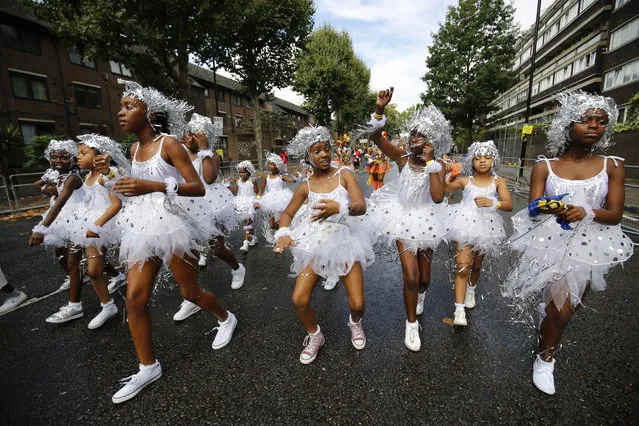 Dancers and children parade on family day of Notting Hill Carnival in west London, Sunday, 28 August 2016. (Photo by Tolga Akmen/London News Pictures)