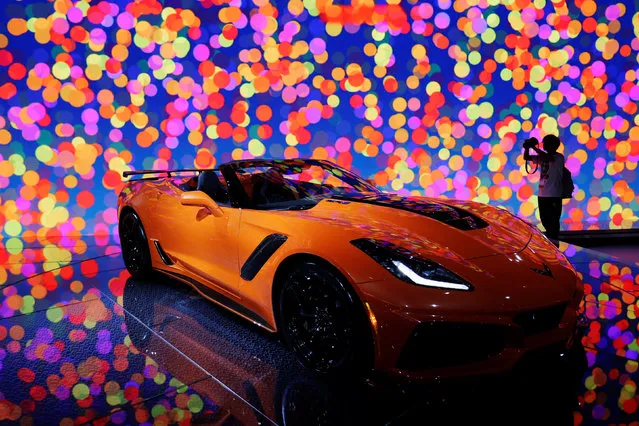 An attendee takes a picture for the new 2019 Chevrolet Corvette ZR1 at the Los Angeles Auto Show in Los Angeles, California, U.S., November 30, 2017. (Photo by Mike Blake/Reuters)