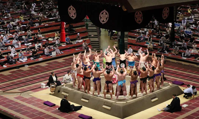 Sumo wrestlers attend a ceremony at Ryogoku Kokugikan hall in Tokyo, Japan, 19 July 2020. The July grand sumo tournament started in front of spectators, the first sumo spectators in six months, due to the coronavirus pandemic. (Photo by JIJI Press/EPA/EFE)