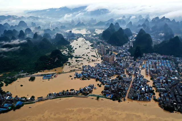 Aerial photo taken on July 11, 2020 shows the Rongjiang River in Rongshui Miao Autonomous County of south China's Guangxi Zhuang Autonomous Region. On July 11, the water level of the Rongjiang River in Rongshui County reached 111.87 meters, 5.27 meters above the warning line. (Photo by Chine Nouvelle/SIPA Press/Xinhua News Agency/Rex Features/Shutterstock)